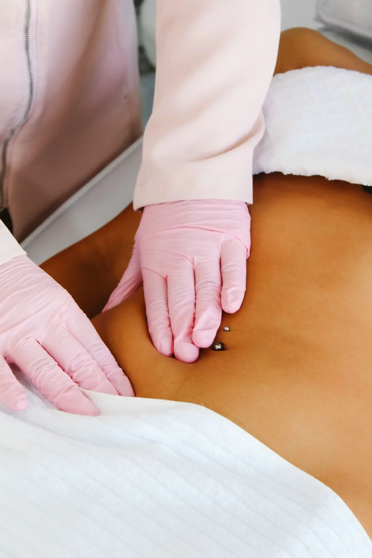 A woman getting a back massage at a spa